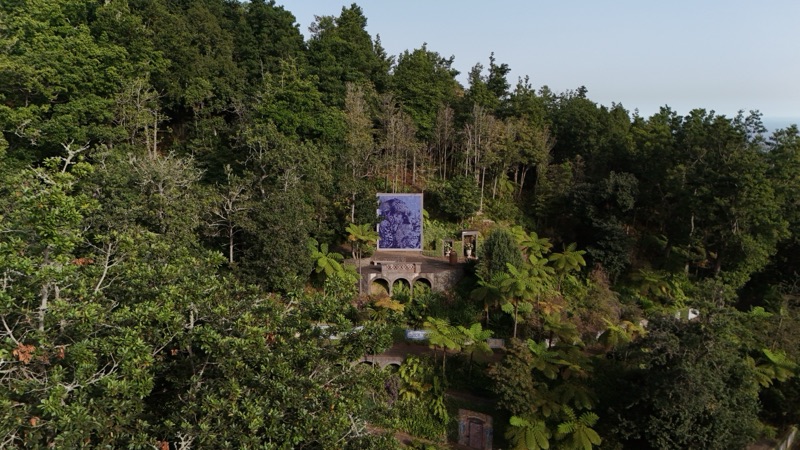 Carved cobalt tile panel above the arched terrace, Monte Palace gardens, Madeira — drone view