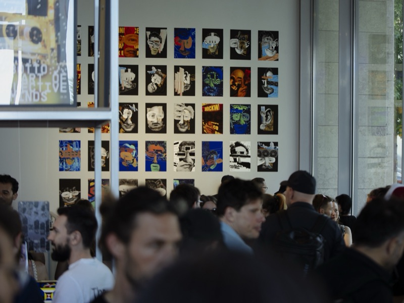 Unpermissioned Self: Proof of Being — opening crowd before the portrait print grid wall, Eterno Gallery